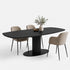 Eettafel Deens Ovaal Column in de kleur Black met een deens ovaal eikenhouten blad en ronde kolompoot op een zwarte stalen onderplaat.