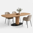 Eettafel Deens Ovaal Column in de kleur Naturel met een deens ovaal eikenhouten blad en ronde kolompoot op een zwarte stalen onderplaat.