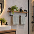 handdoekrek industrieel staal die in een moderne badkamer hangt met 2 handdoeken.