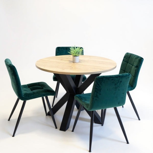 Industriële ronde eiken eettafel met zwart metalen spinpoot onderstel en groene velvet stoelen