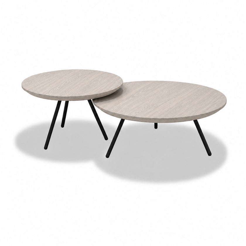 Ronde salontafel Nova met wit gebeitste eiken tafelbladen en zwarte metalen poten
